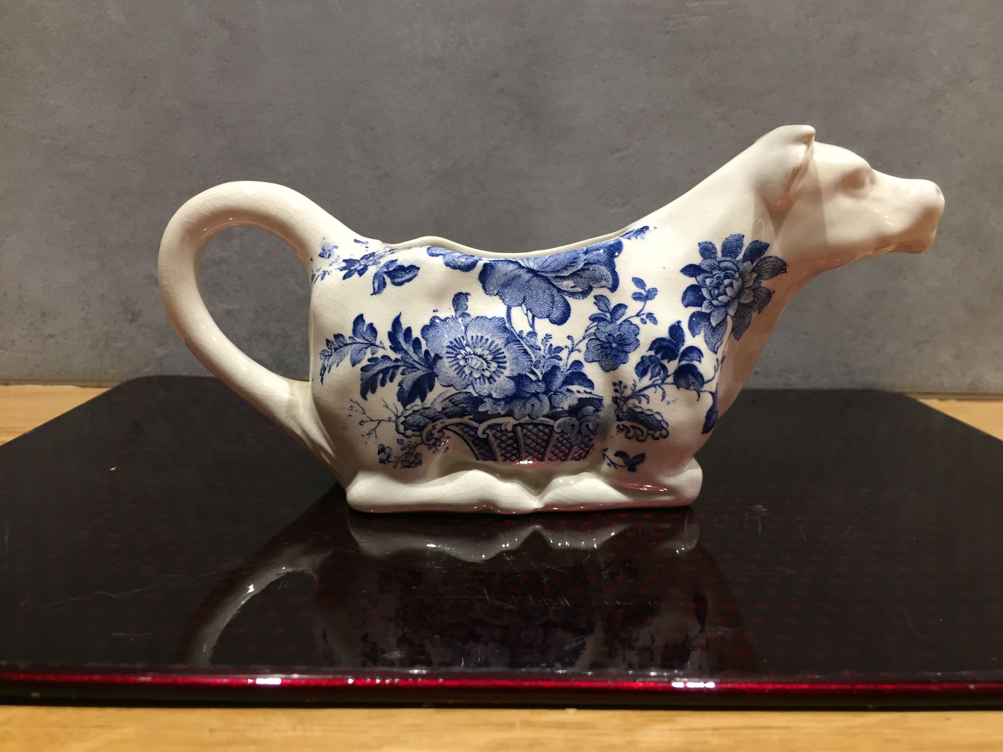 English porcelain cow-shaped sauce dish
