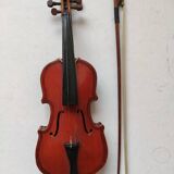 violin and decorative archer in antique varnished wood