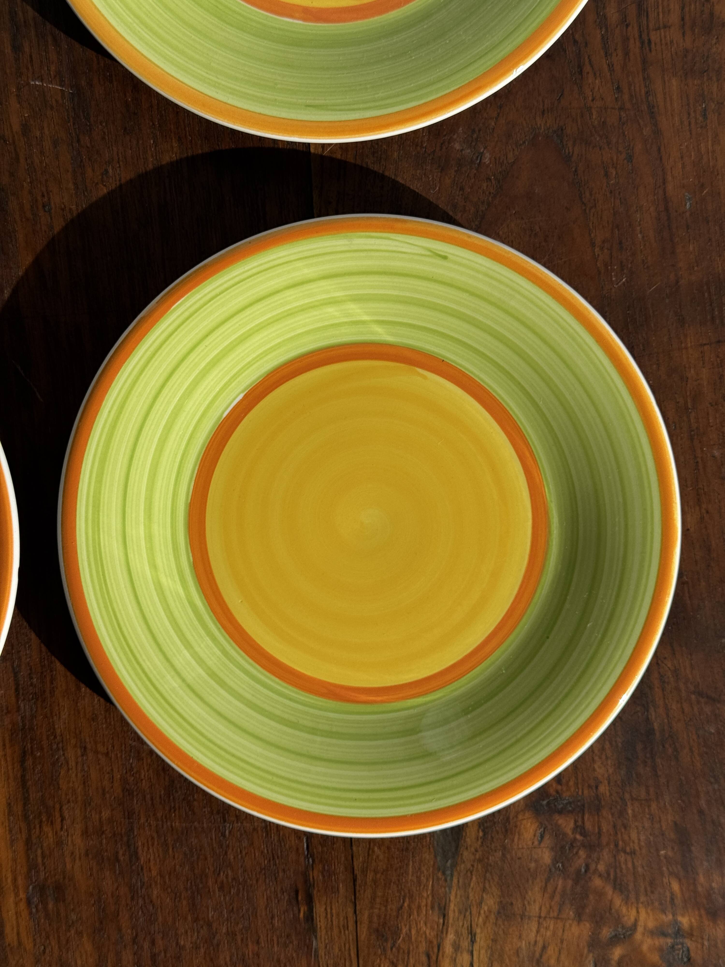 Set of 4 Italian ceramic plates in green, orange, and yellow splashes D20.