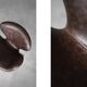 Brown leather Swan chair by Arne Jacobsen, mid-century Danish modernity.