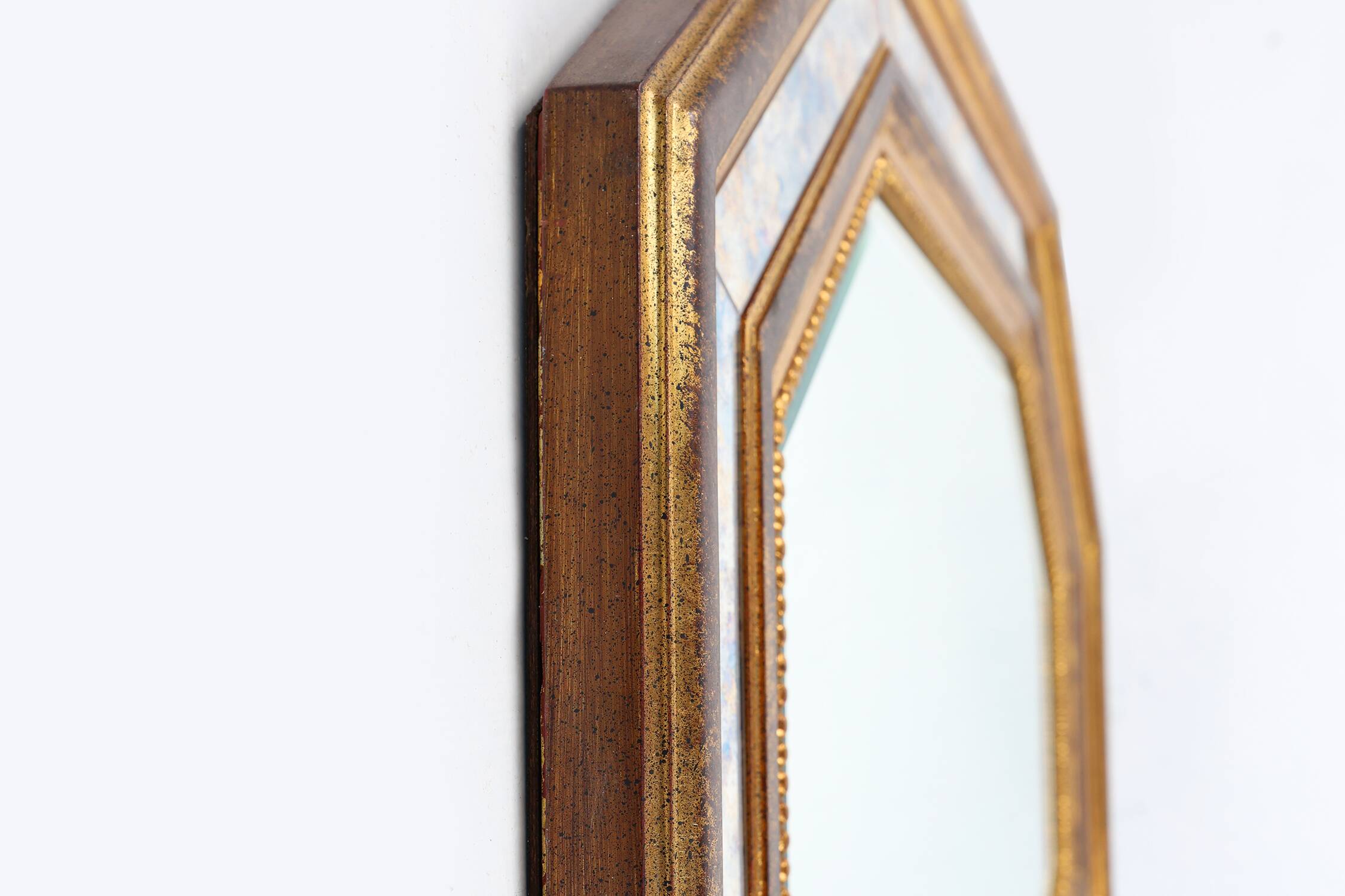 Gilded octagonal mirror by Deknudt Belgium decorated with smoked mirror gla