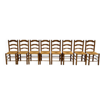 Set of 8 chairs in solid elm with straw seats.