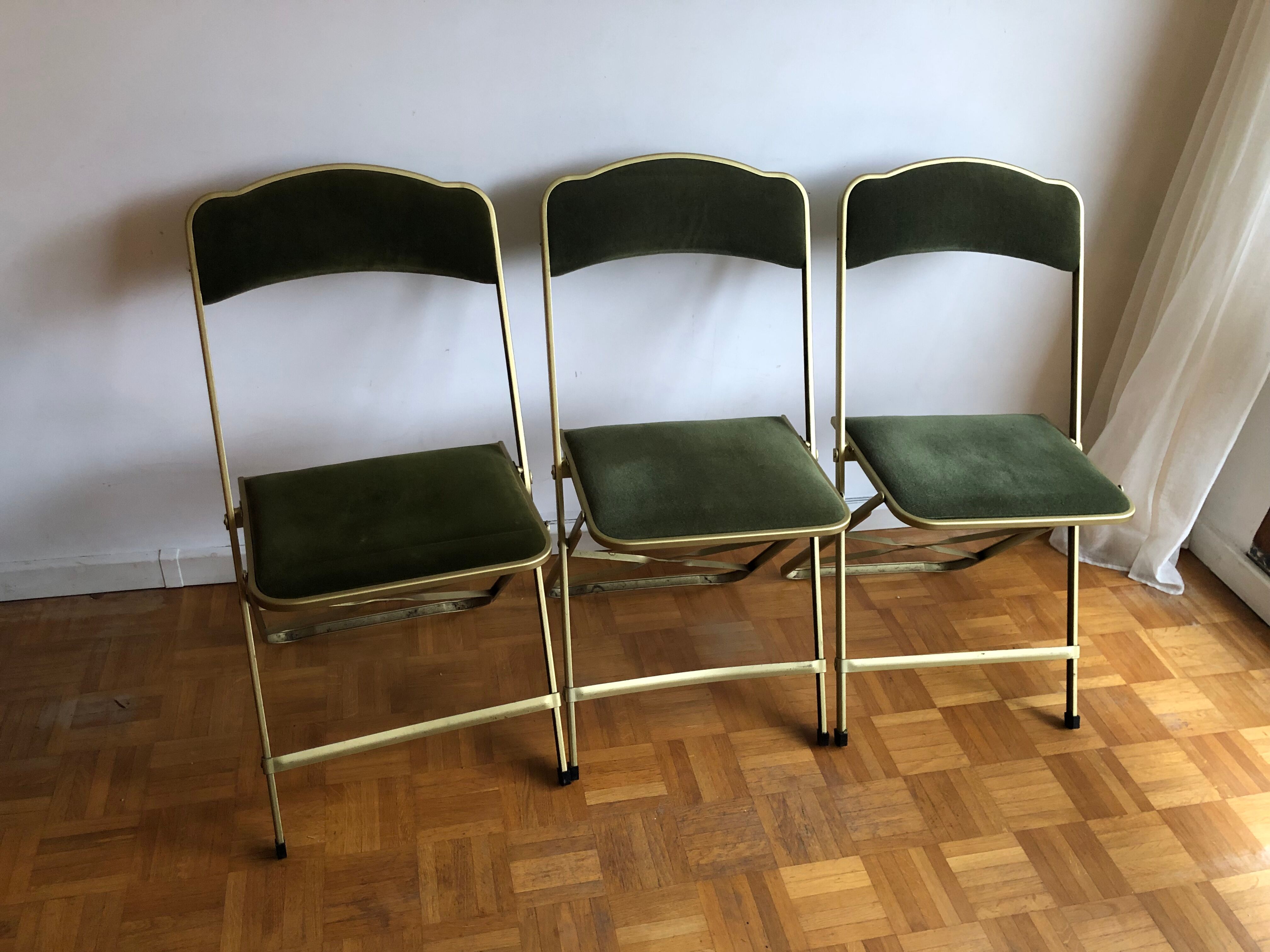 Set of three vintage green folding chairs