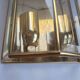 Pair of wall sconces in gold-plated brass with bevelled glass, Italian.