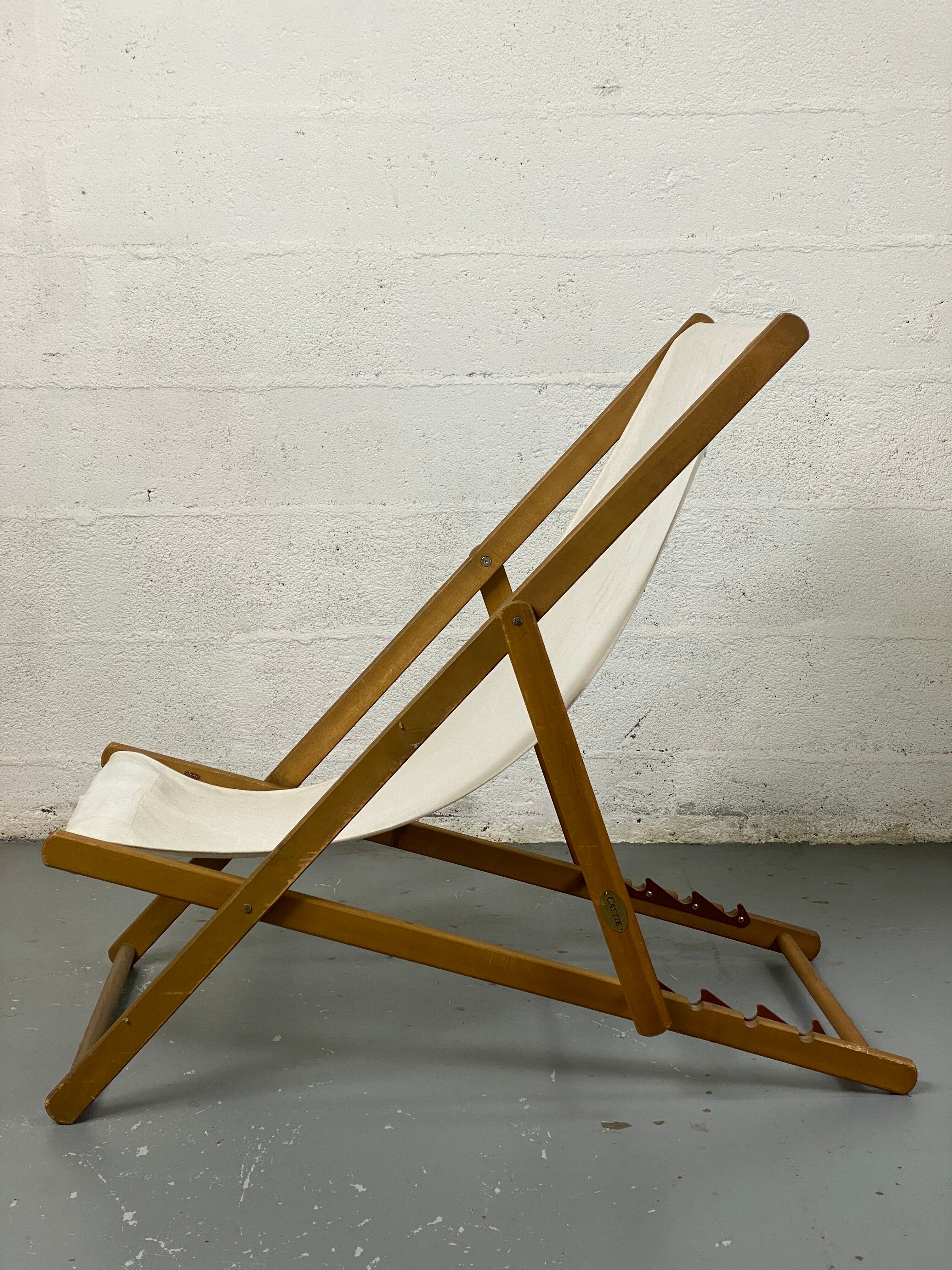White fabric deckchair with wooden structure
