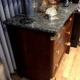 Empire chest of drawers with half columns in mahogany and gilded bronze