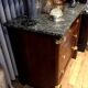 Empire chest of drawers with half columns in mahogany and gilded bronze