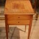 Nightstand with veneer and 4 drawers.