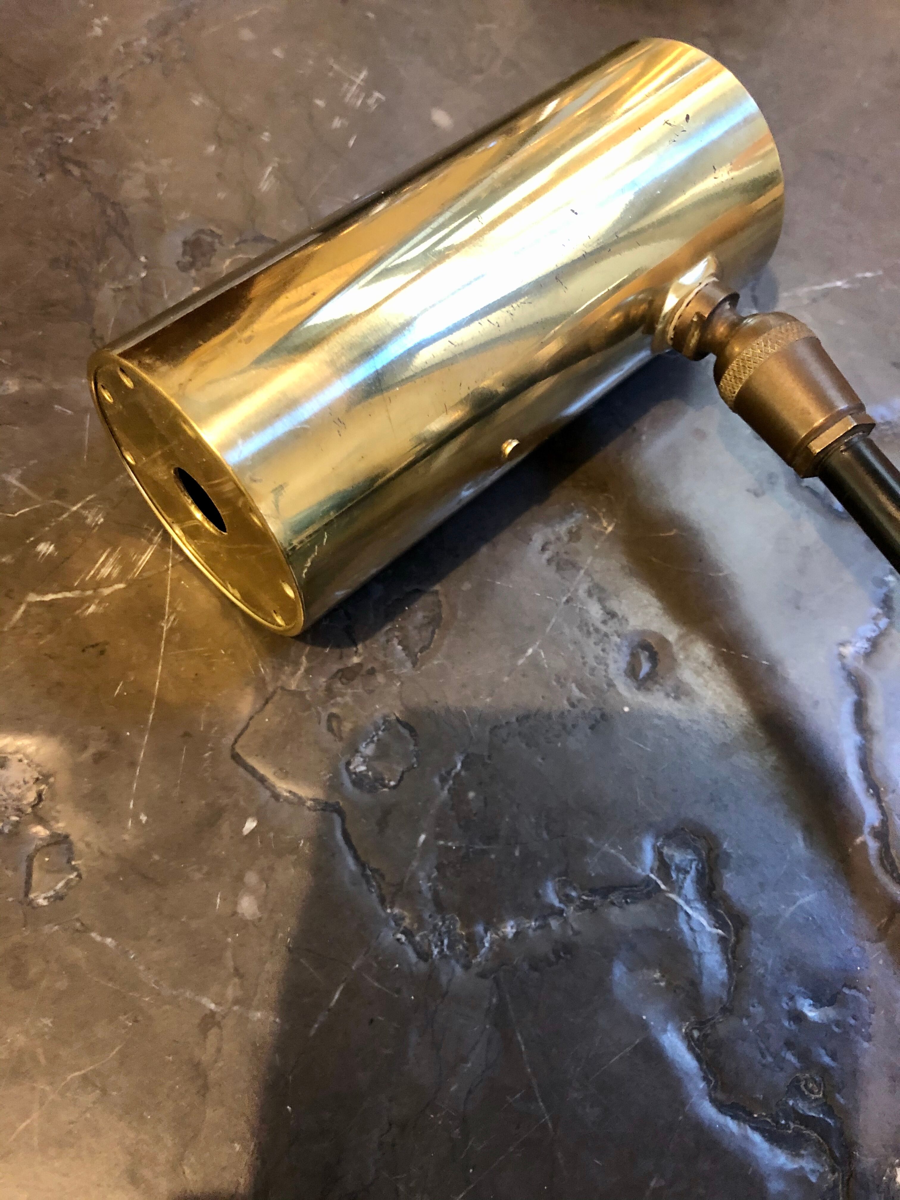 Sconce in gold brass and black metal