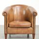 Vintage sheepskin club armchair finished with decorative nails