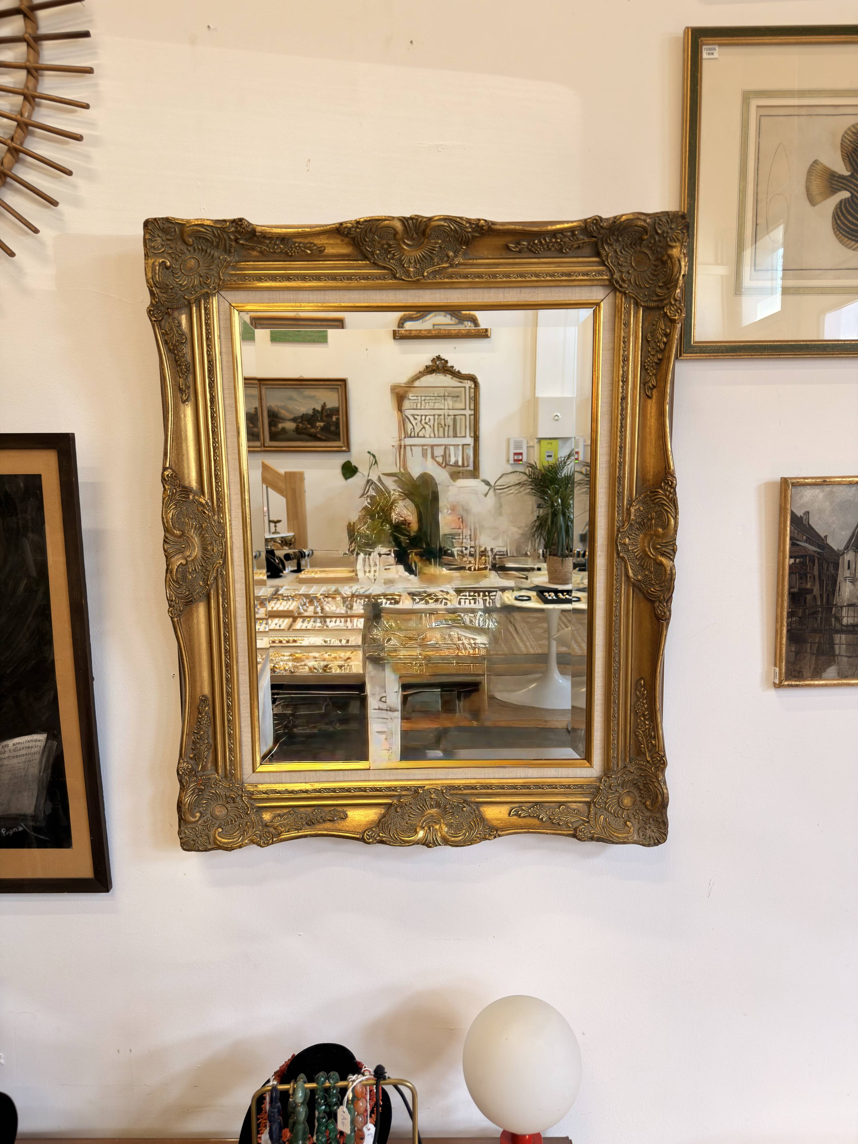 Golden wooden mirror in Louis XV style