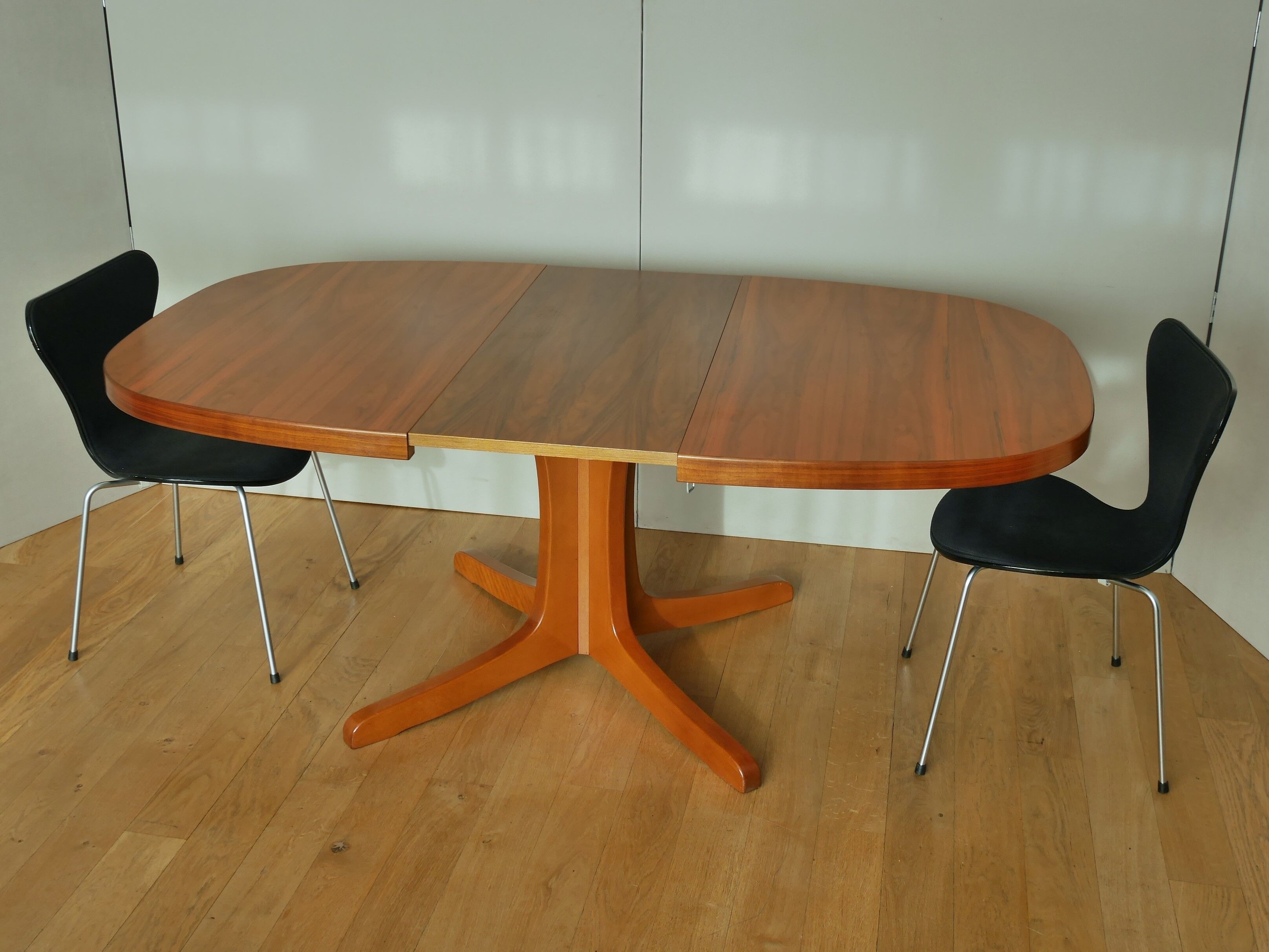 Oval walnut table with extension cords