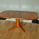 Oval walnut table with extension cords