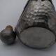 Vintage decanter in glass and tin.
