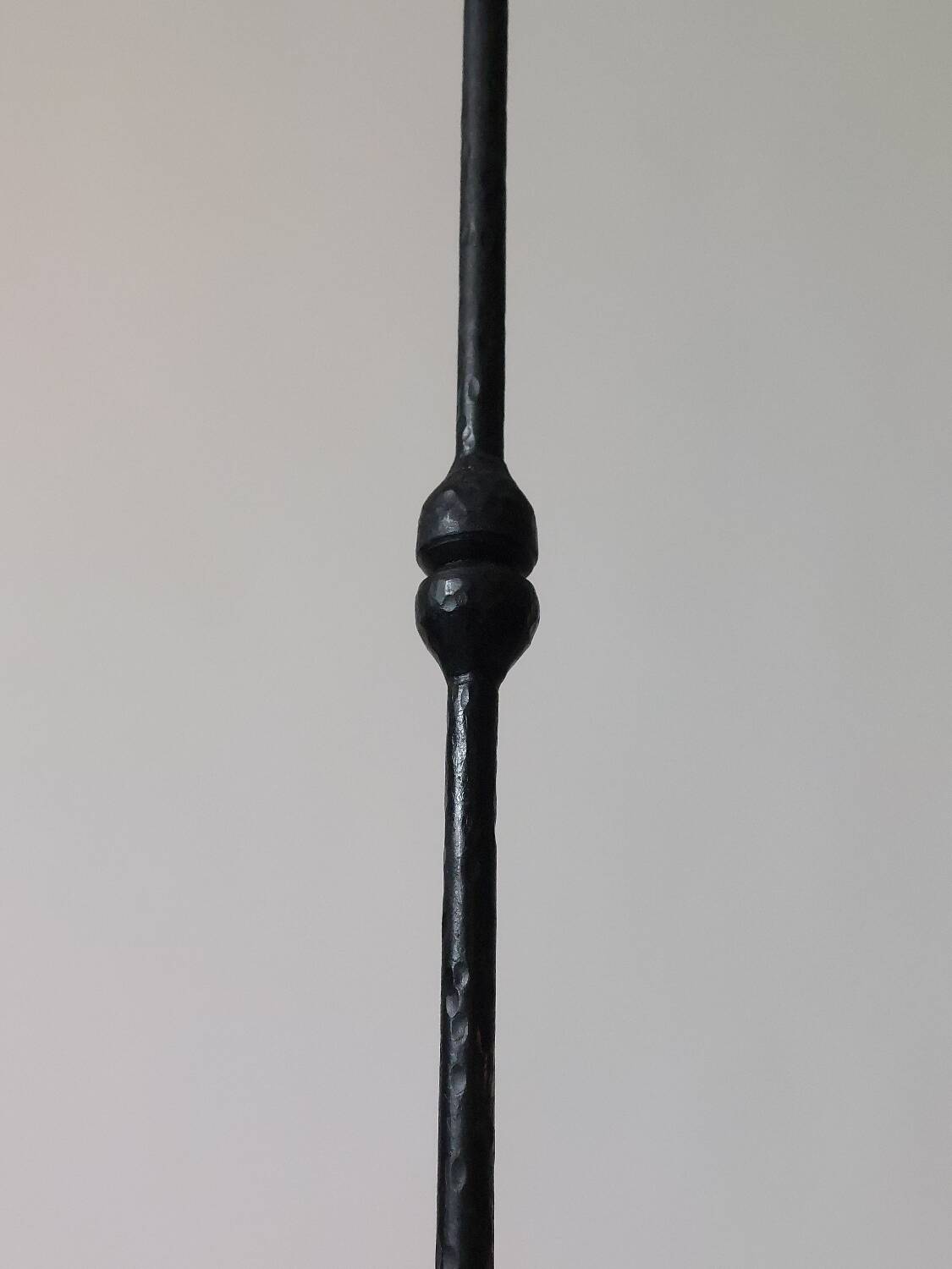 A pair of beautiful and exquisite vintage wrought iron candlesticks from the mid-century.