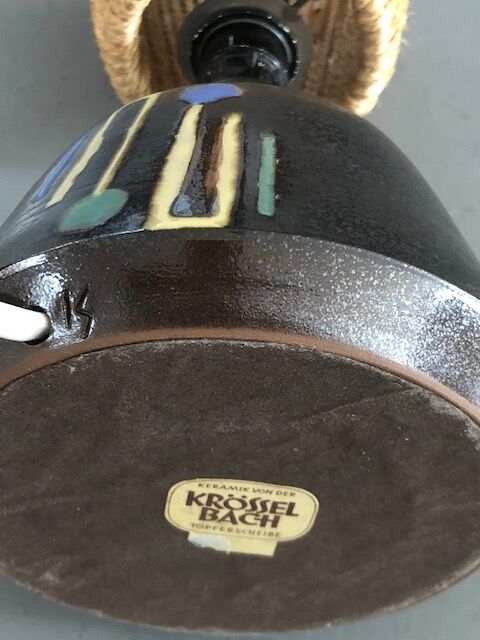 Brutalist style laying lamp with rope lampshade and ceramic foot