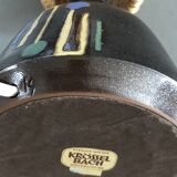 Brutalist style laying lamp with rope lampshade and ceramic foot