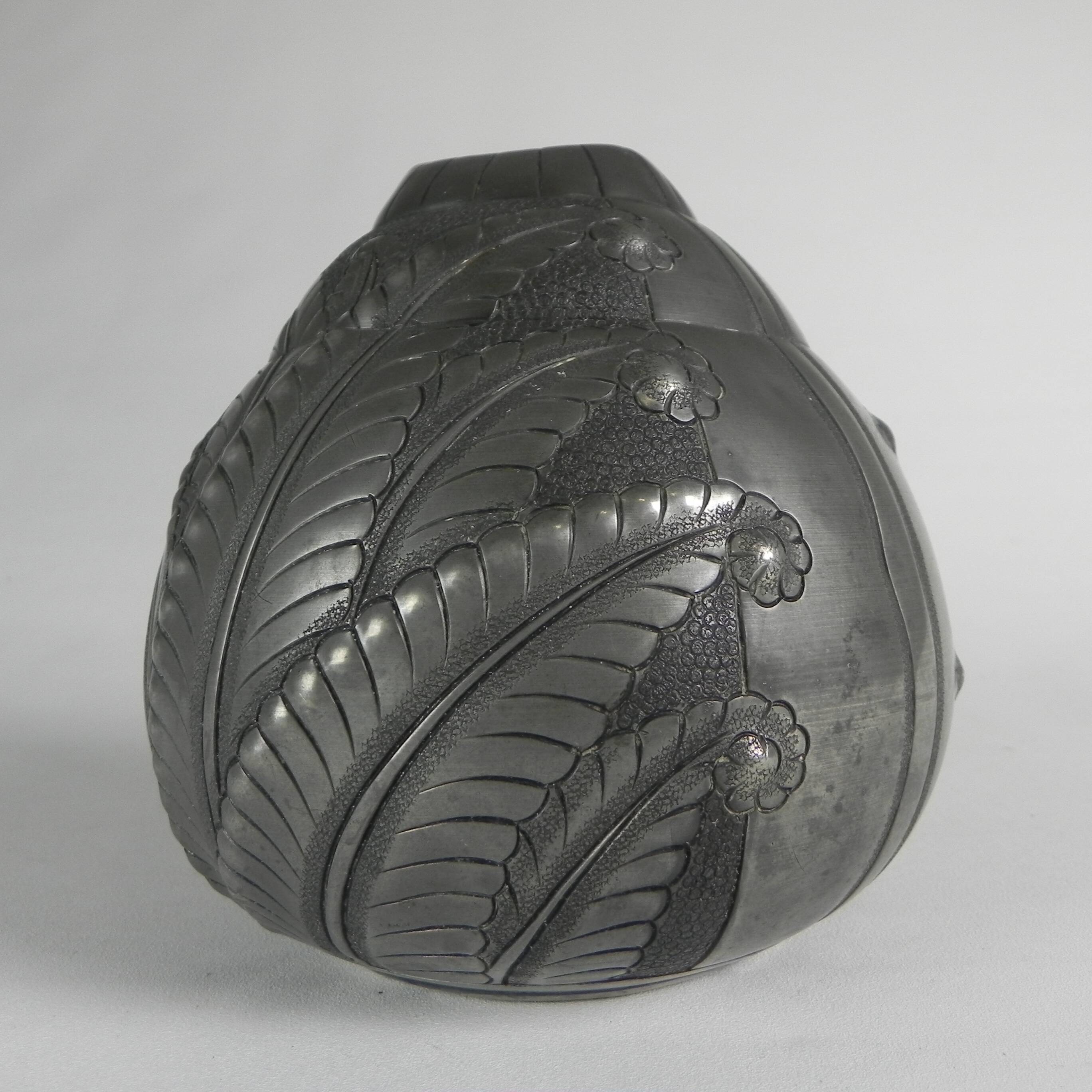 Art Nouveau pewter vase, signed PETIZON, early 20th century.