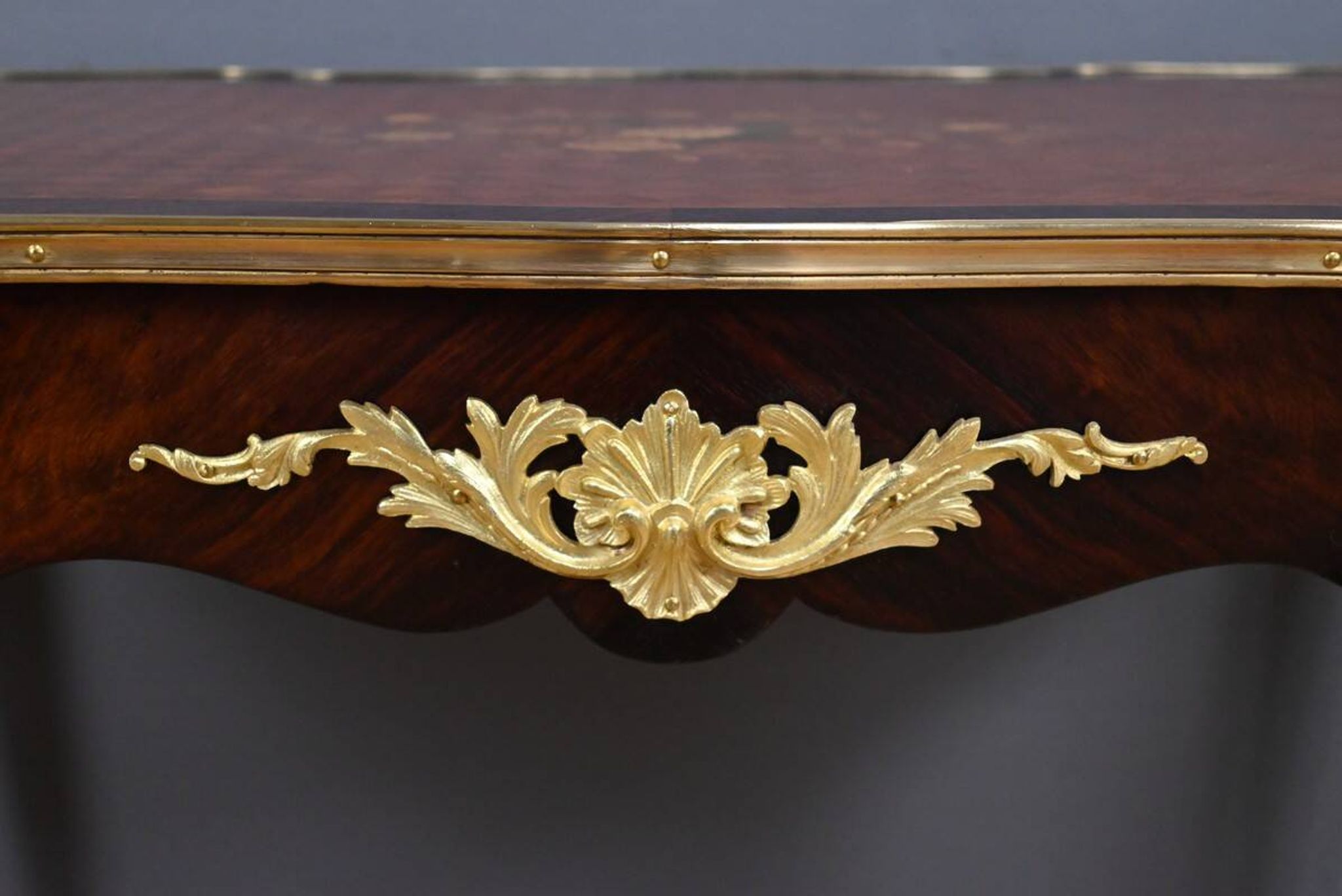 Rosewood, mahogany, and rosewood desk-table, Louis XV style – early 20th century.