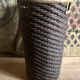 High basket in braided wicker