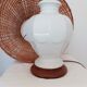 Ceramic lamp with rattan lampshade.