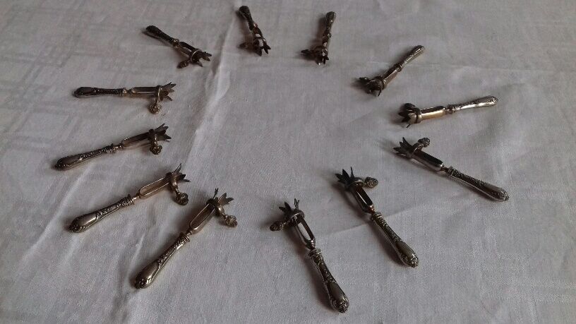 Lot of 12 sleeves with leg, silver metal