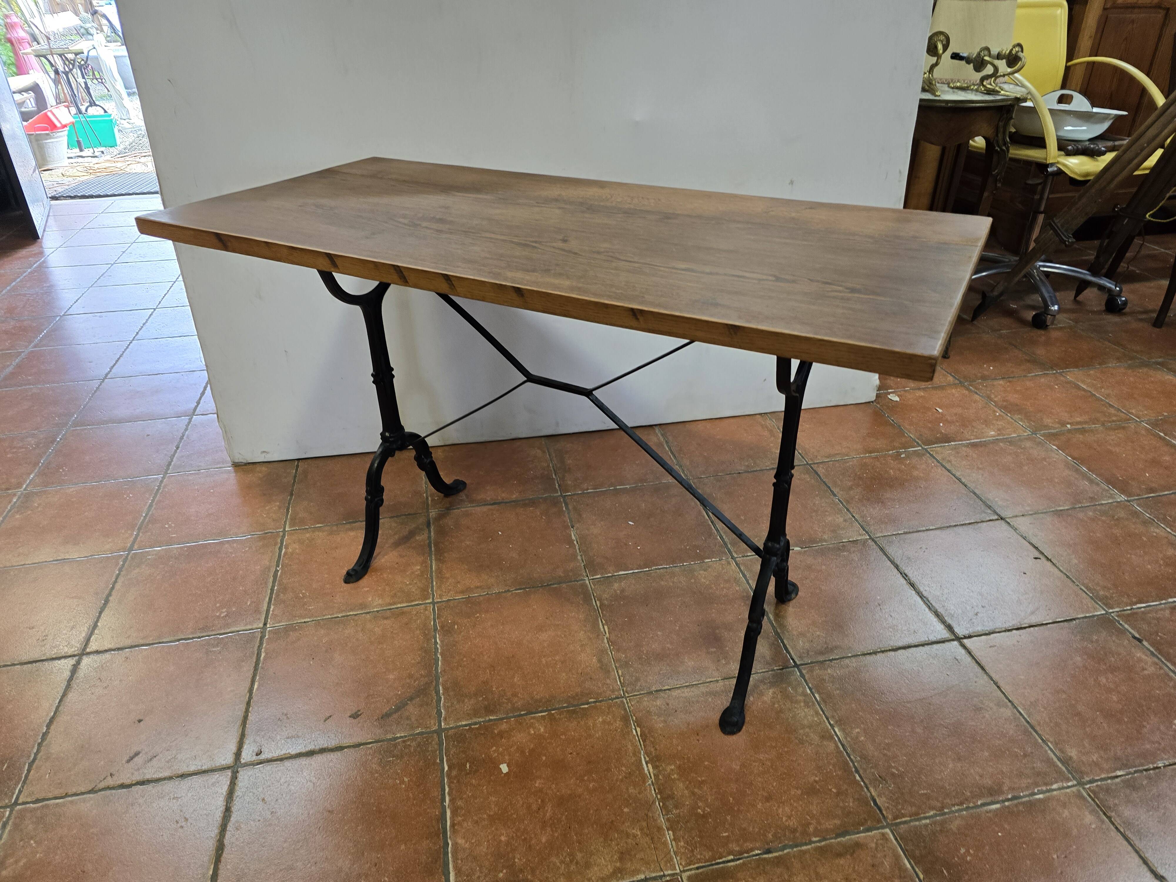 Old bistro table with oak top, cast iron base, 118 cm L
