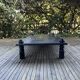 Table basse bois teinté noir brutaliste