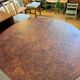 Oval extendable dining table in wood and walnut burl veneer.