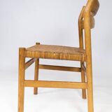 A set of four dining room chairs in oak and seat in papercord, designed by Børge Mogensen