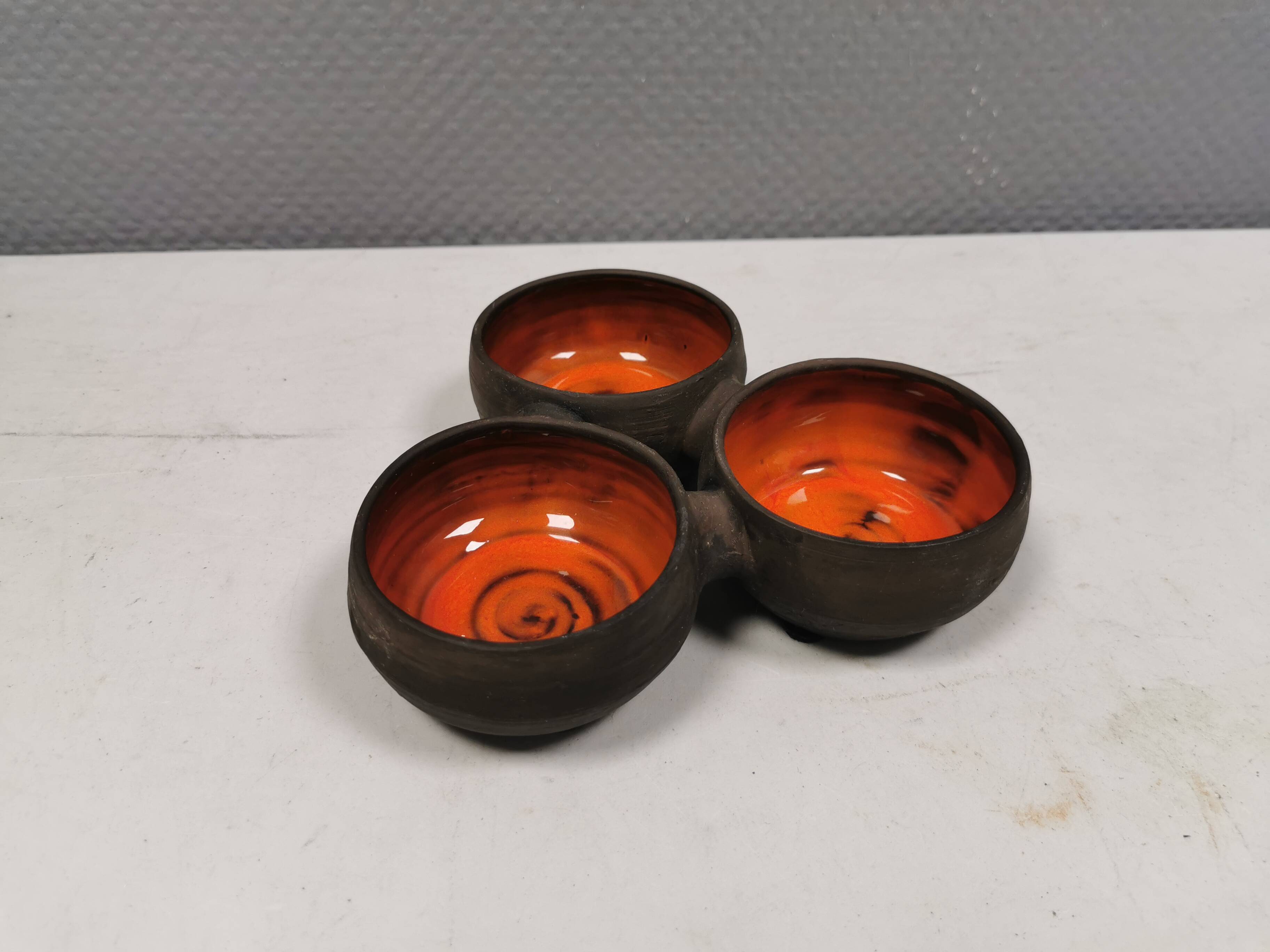 Beautiful bowl (composed of 3 bowls) with orange/red glaze inside