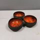 Beautiful bowl (composed of 3 bowls) with orange/red glaze inside