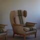 Pair of high-back lounge chairs in modern Danish style in the manner of Henning Kjærnulf, 1960s.