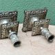 Pair of square candlesticks in patinated bronze