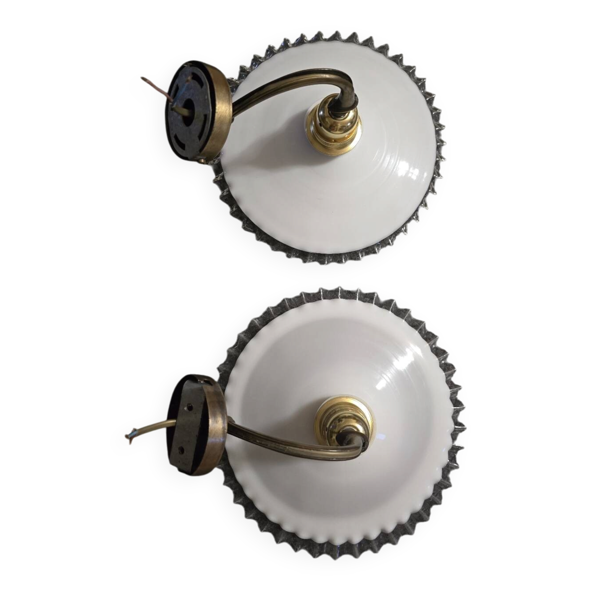 Wall sconces with scalloped opaline lampshades.