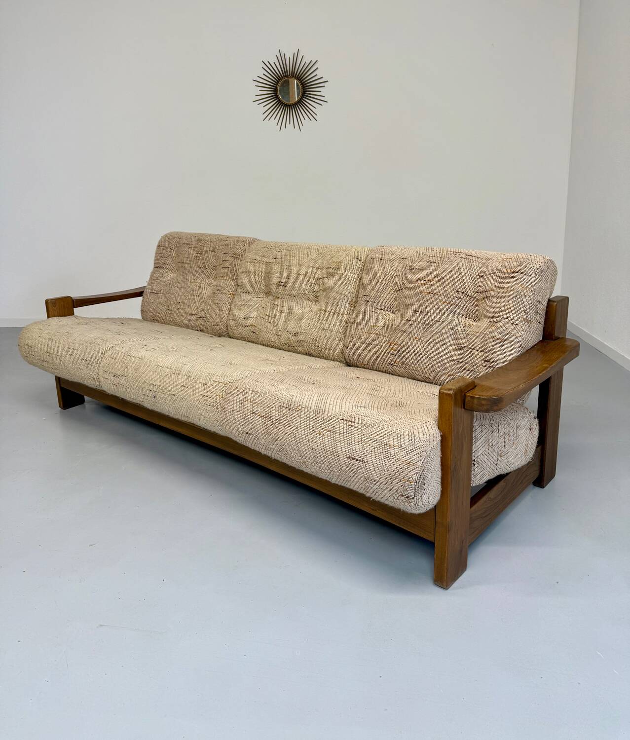 Old 3-seater sofa in solid wood, Maison Regain design, from the 70s.