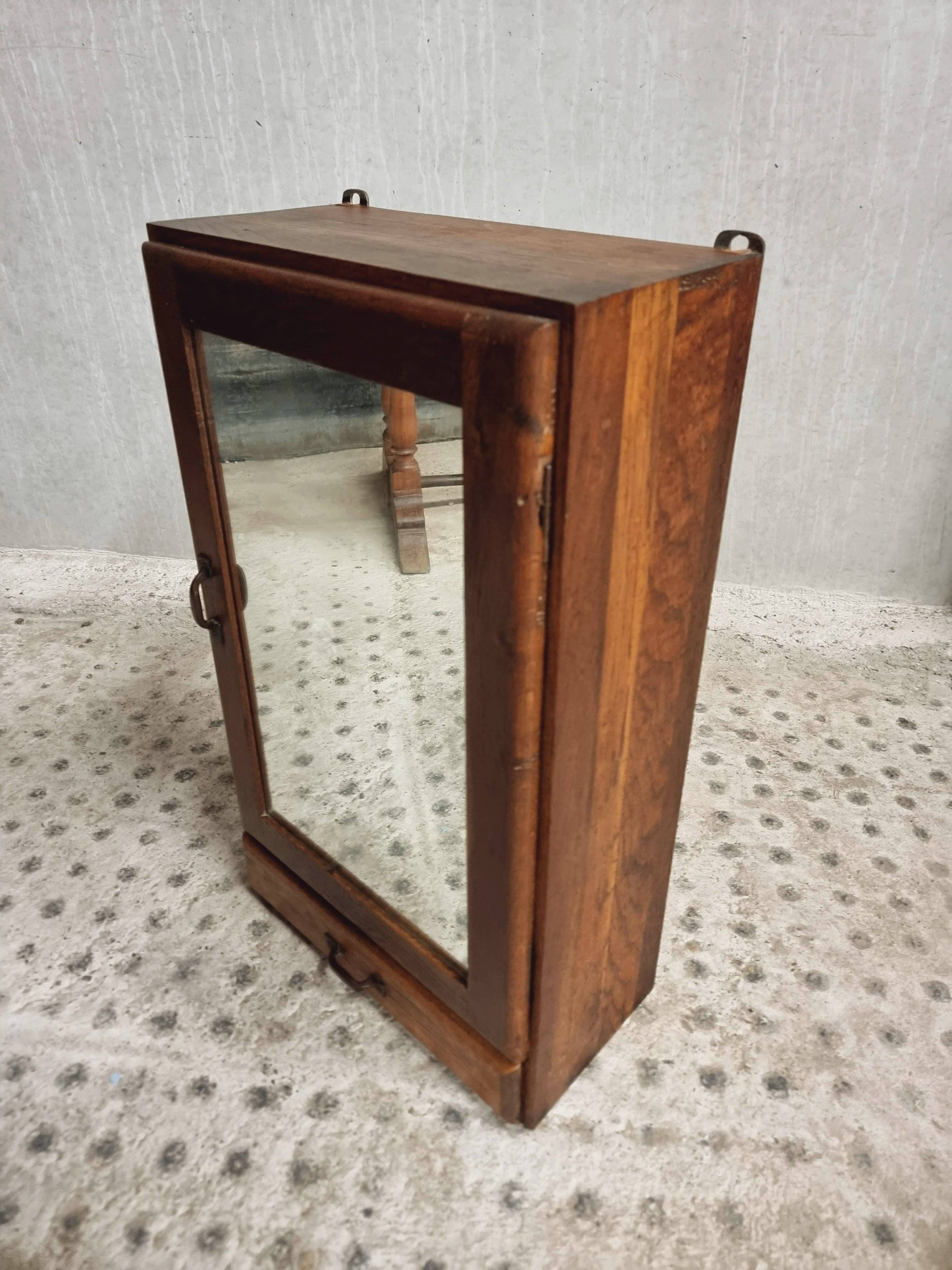Old hanging cupboard medicine cabinet with mirror and drawer