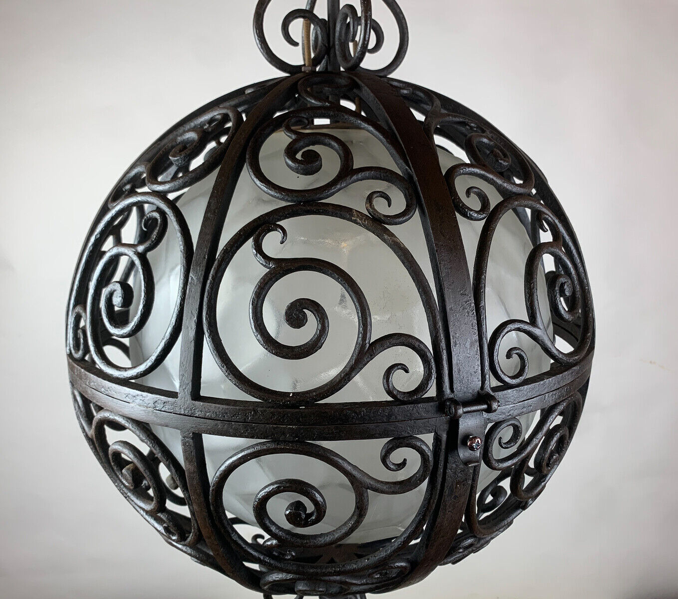 Wrought iron round suspension with interior glass sphere, c.1930