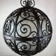 Suspension ronde en fer forgé avec sphère intérieure en verre, c.1930