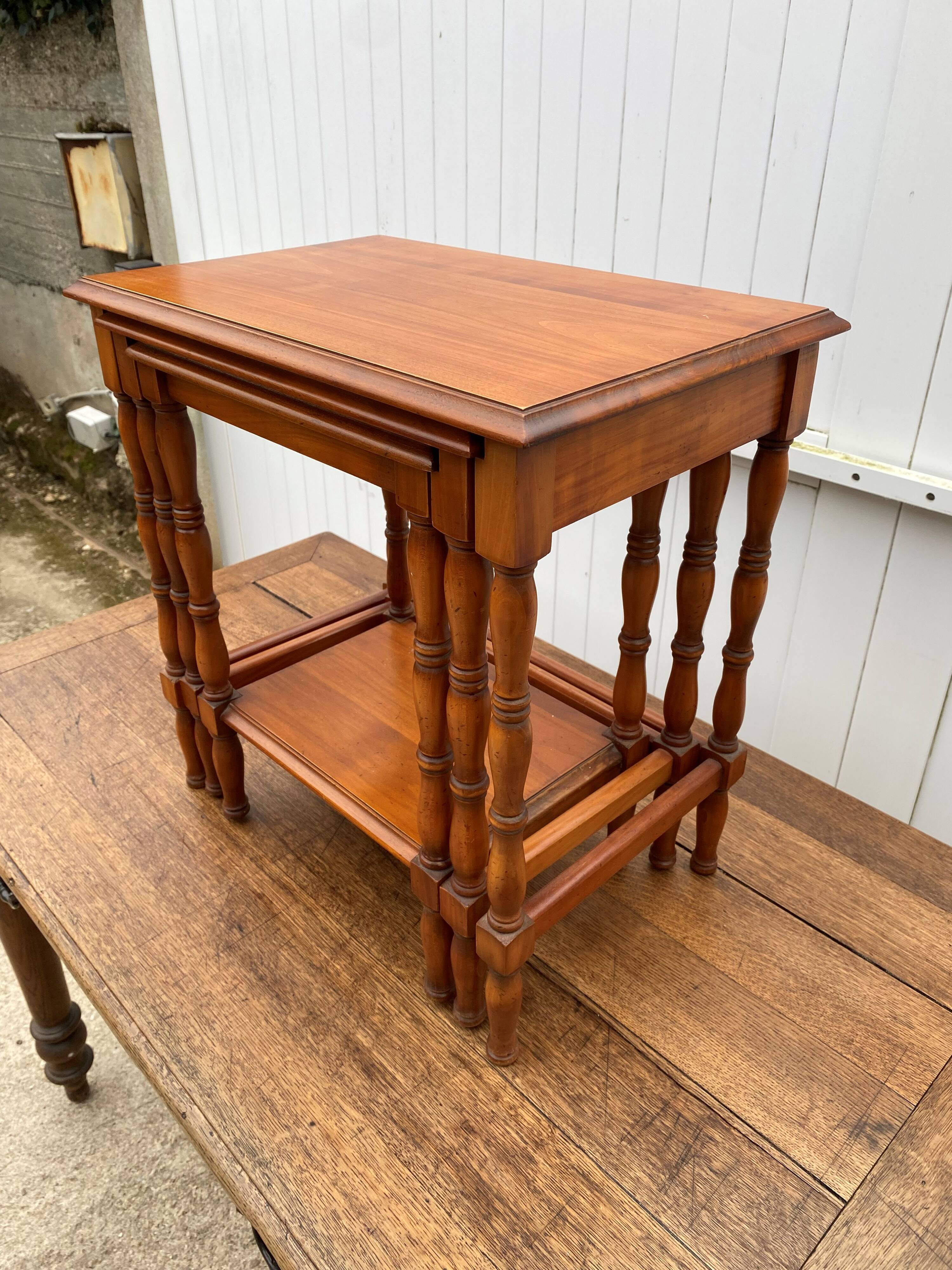 Set of 3 rustic cherry wood nesting coffee tables from the 1950s.