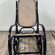 Rocking chair in blackened curved wood and cane, 1900s