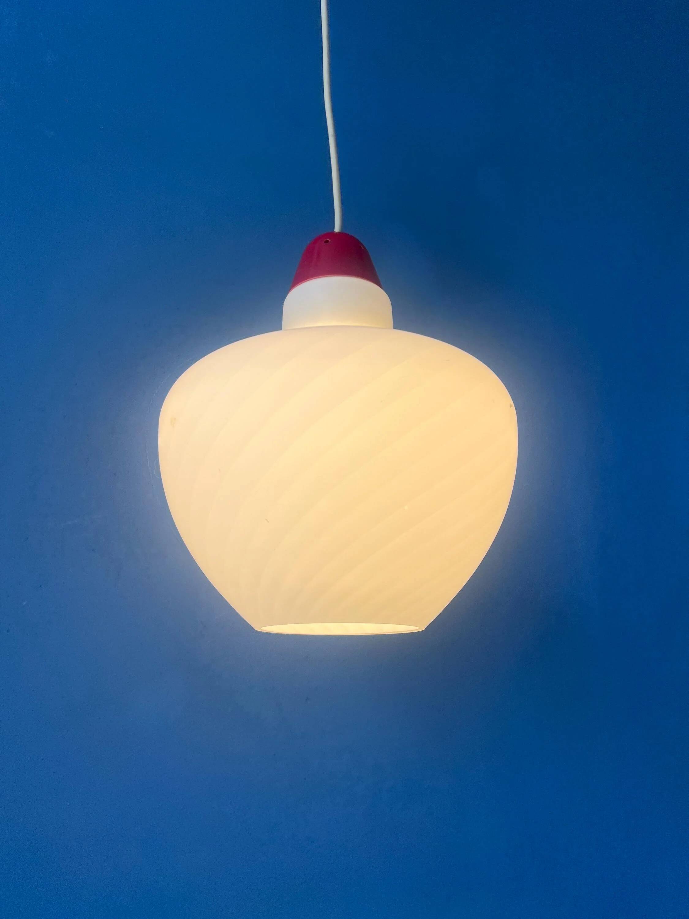 Mid-Century opaline glass suspension with a red upper part and ceiling cover.
