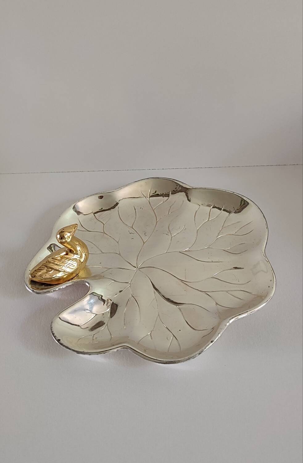 A Lancel pocket tray in silver metal.