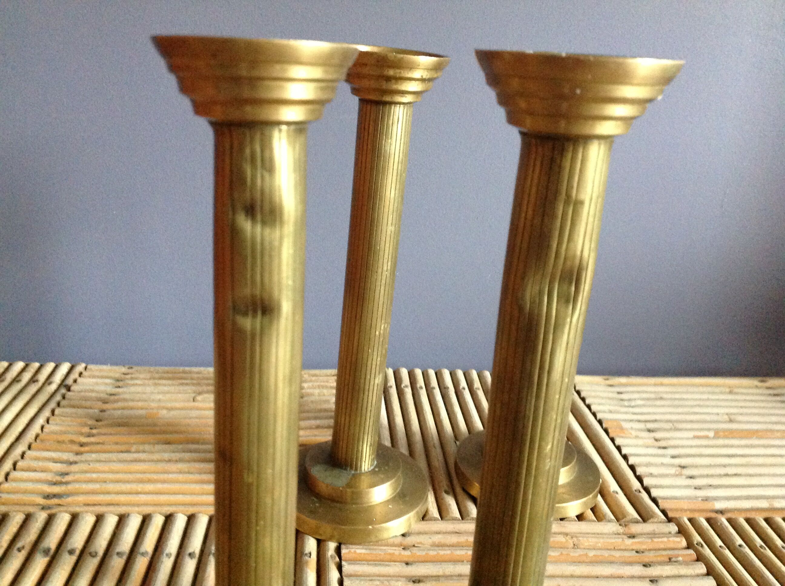 Series of 4 brass candlesticks