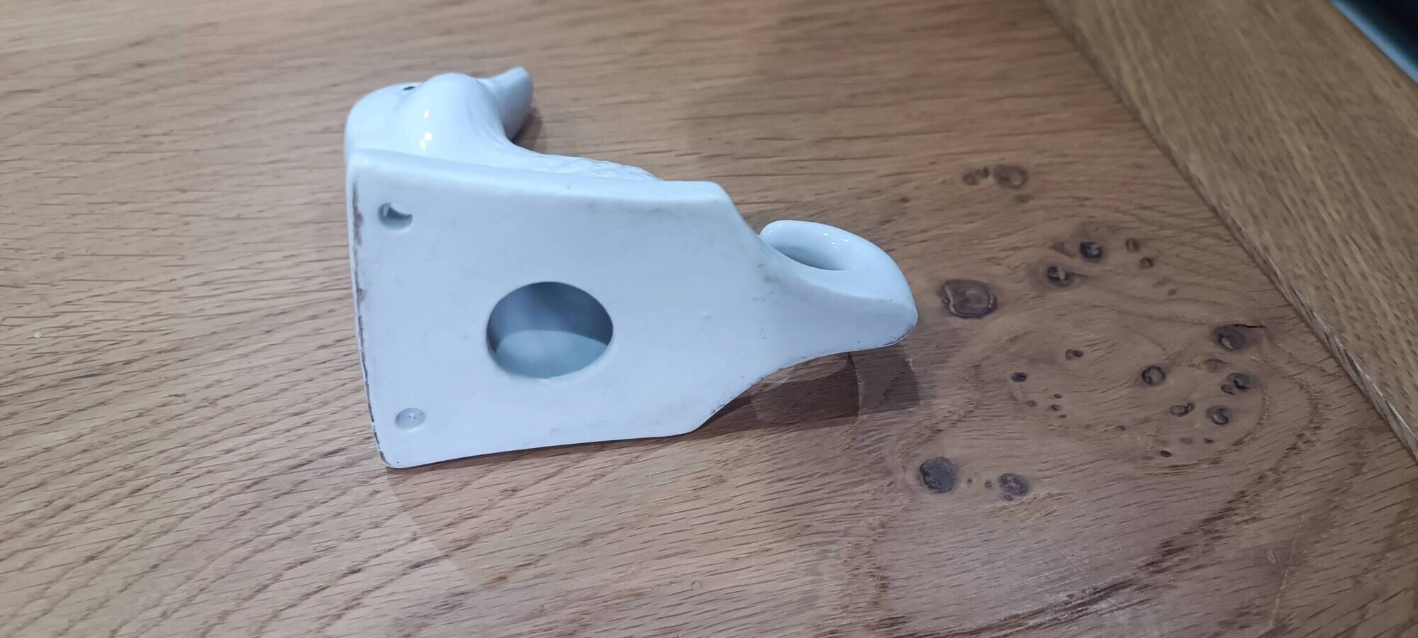 Wall-mounted duck head coat hook in white ceramic, cottagecore style.