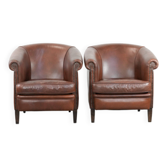 Unique set of two cognac-coloured cow leather club armchairs