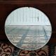 Miroir rond biseauté et ciselé