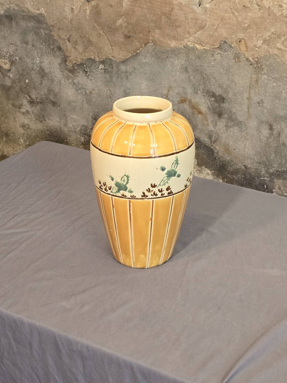 Orange and green ceramic vase with duck motif