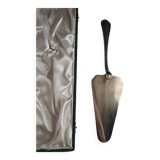 Silver metal cake peeler.