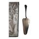 Silver metal cake peeler.